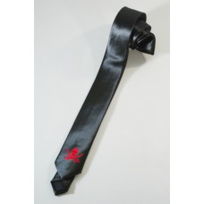 Narrow skinny tie with skull and swords, also pirate-style. Red