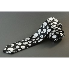 Narrow skinny tie with skulls of various sizes, black background